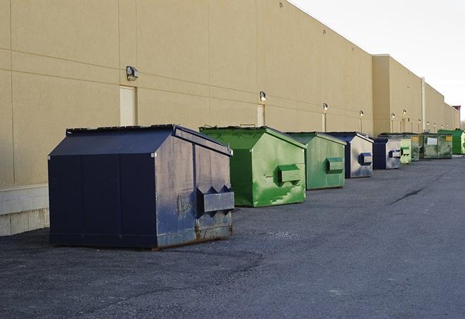 construction dumpsters on a worksite surrounded by caution tape in Archer City